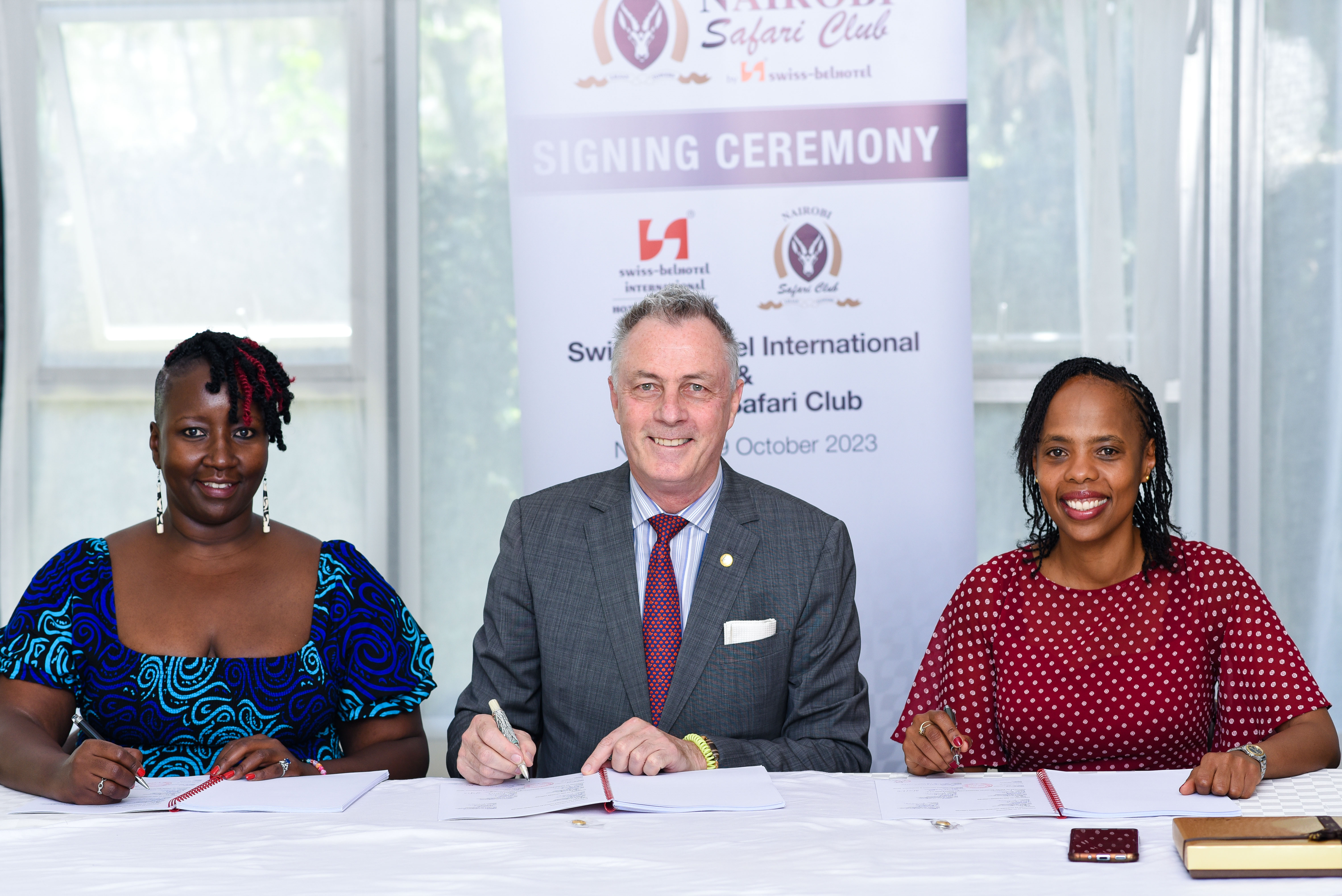 Clare Njeri Githunguri and Lilian Joy Nyagaki Githunguri with Laurent Voivenel