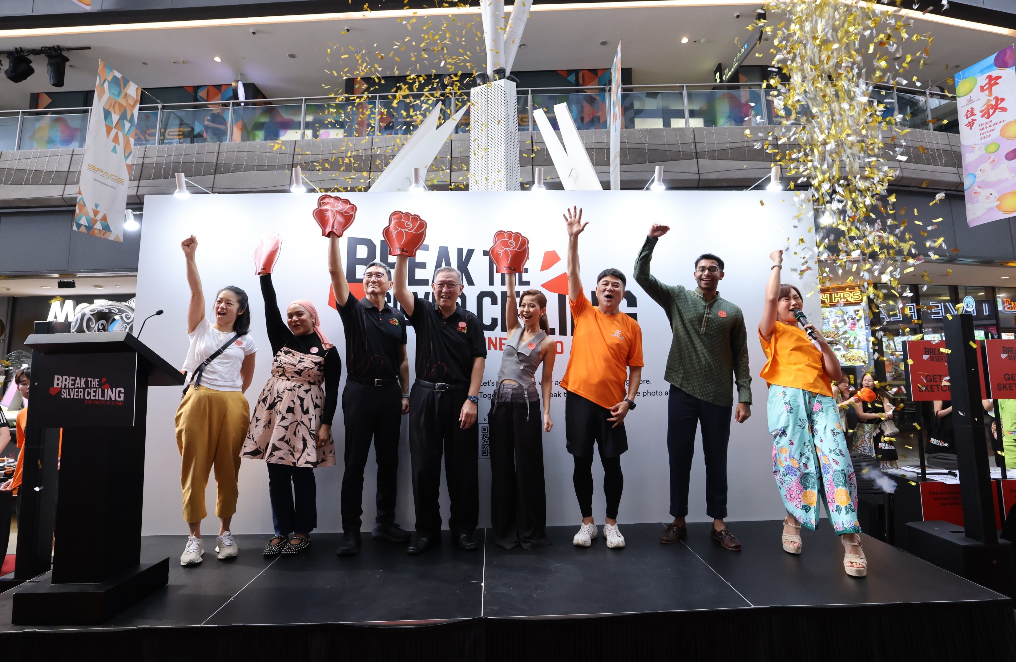 The “Break the Silver Ceiling: One Photo at a Time” Exhibition was launched by AIC Chairman Dr Gerard Ee, fourth from left, at Our Tampines Hub on 1 October 2024. He was joined by (from left to right) Ms Mindy Tan, Ms Amiera Raushan, Mr Noel Cheah, Ms Hanan Al-Johary, Mr Jack Neo, Mr Ian Jeevan, and Ms Lim Peifen.