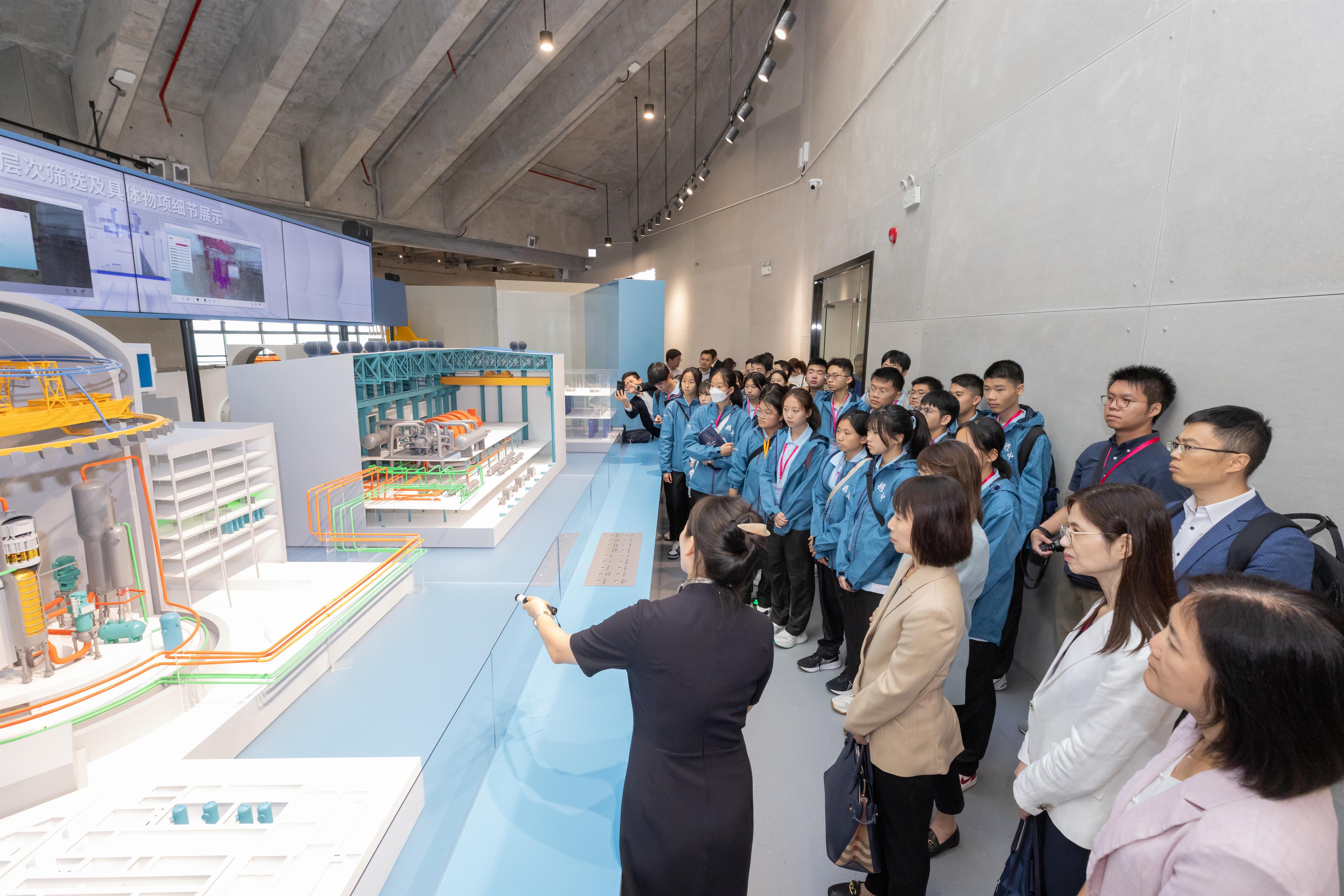 The students watch the Hualong One nuclear reactor model and other exhibits at the Daya Bay Nuclear Power Science and Technology Museum, learning about China’s third-generation nuclear power technology.