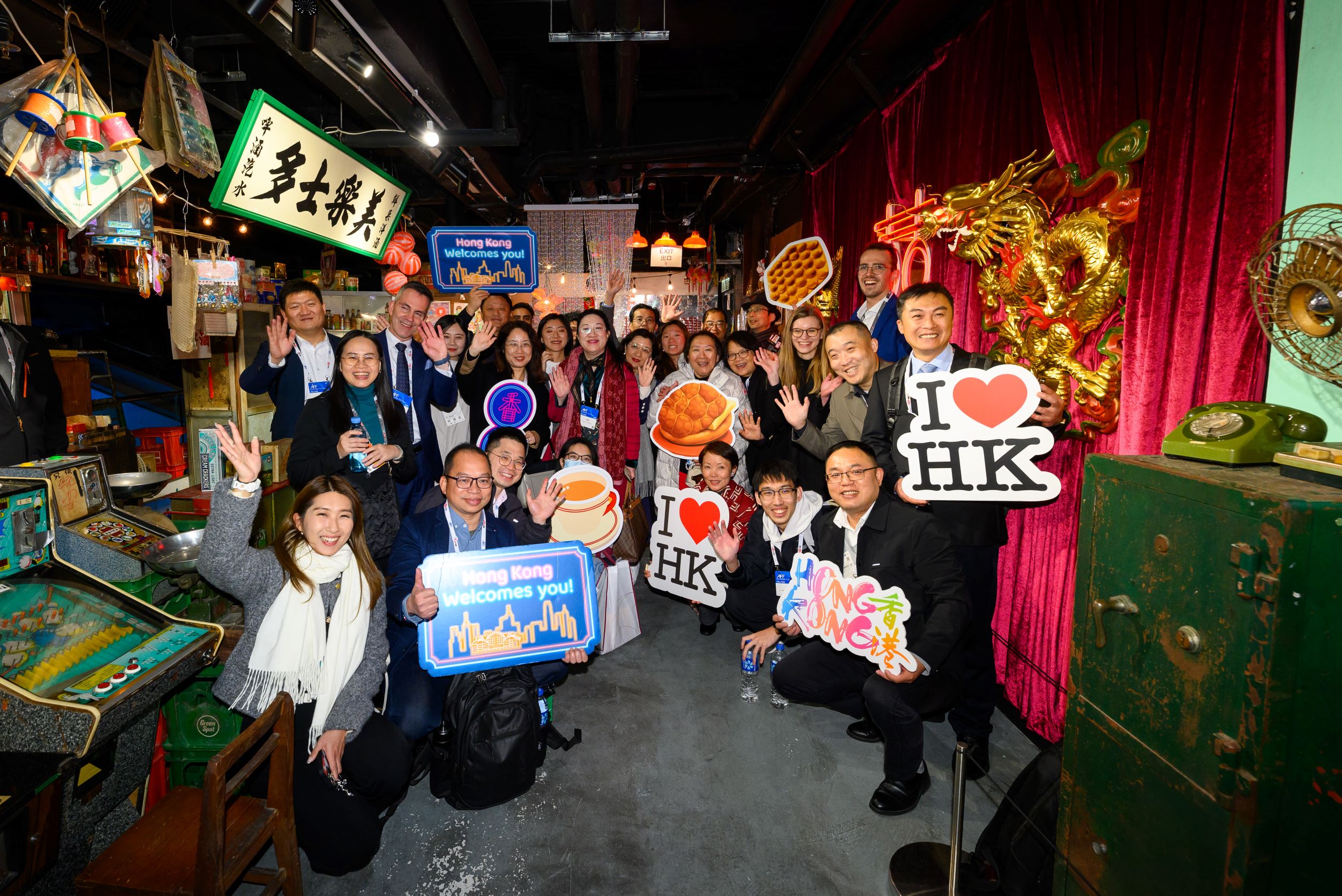 Asia Financial Forum guests at a corner store full of local nostalgia