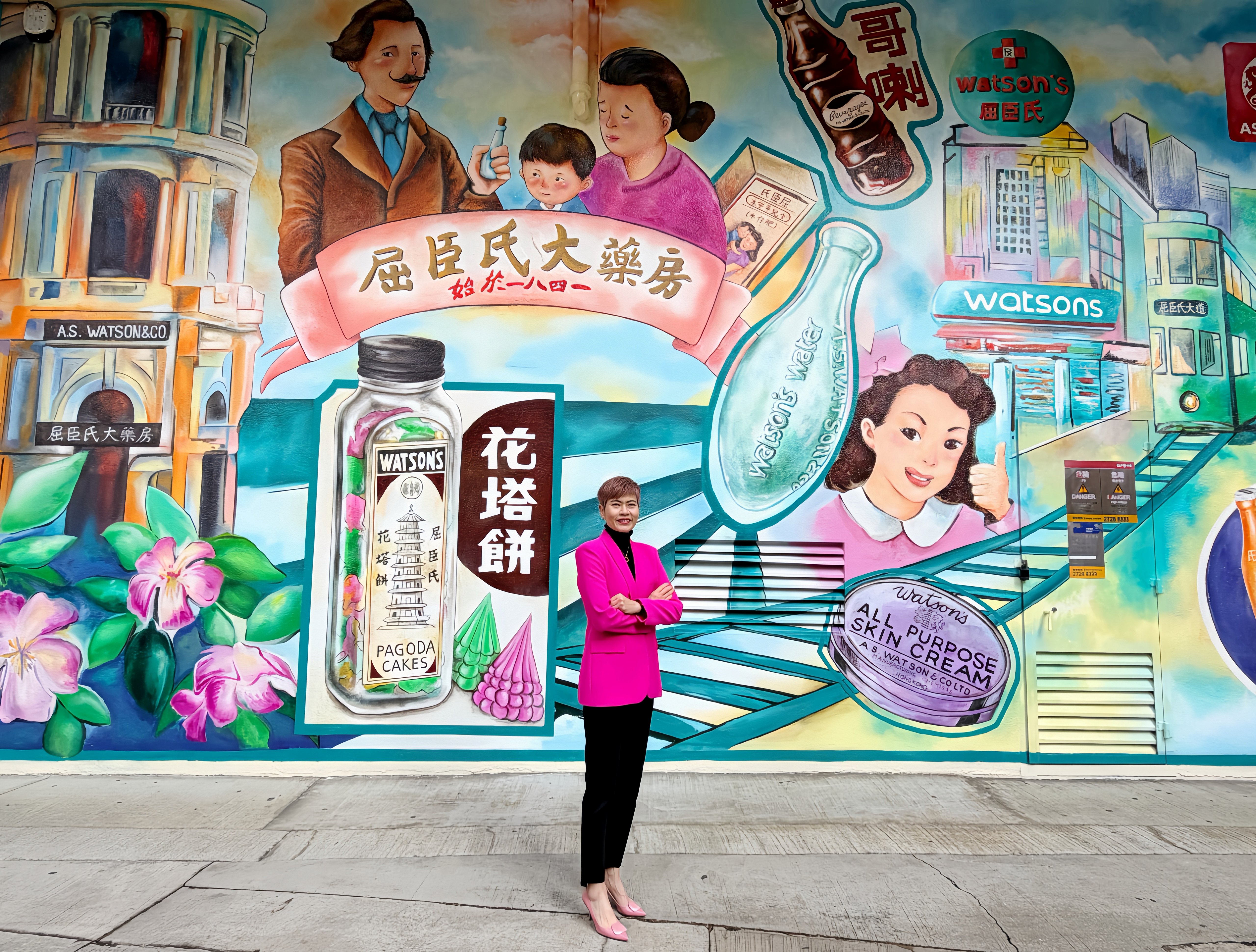 AS Watson Group CEO Dr Malina Ngai stands in front of a 6-meter-tall mural depicting the company
